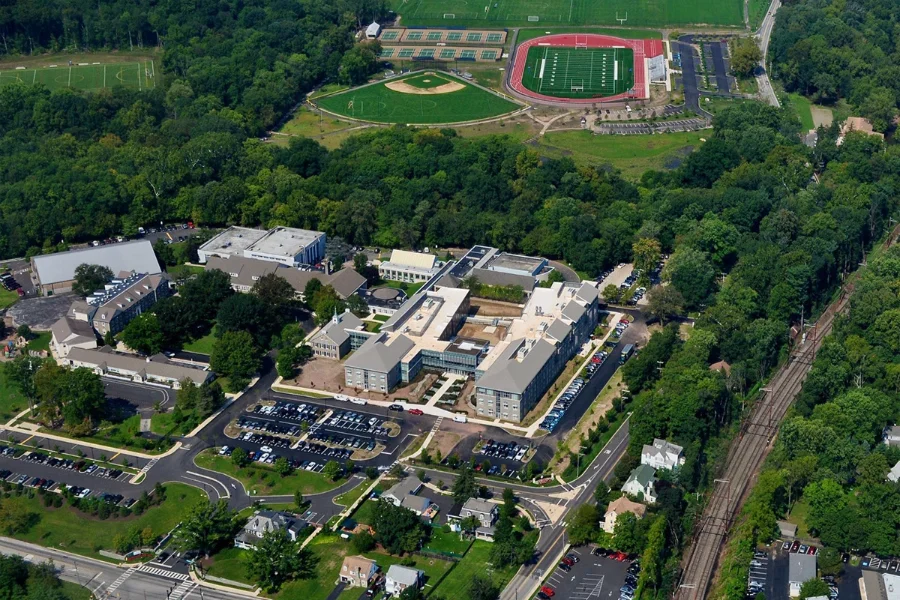 aerial view of frederick school campus with buildings and sports fields