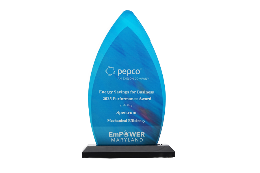 Blue glass award with "pepco Energy Savings for Business 2025 Performance Award" text and EmPOWER Maryland logo.
